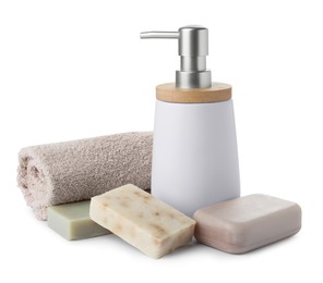 Photo of Soap bars, dispenser and terry towel on white background