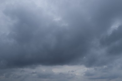 Photo of Sky with heavy rainy clouds on grey day