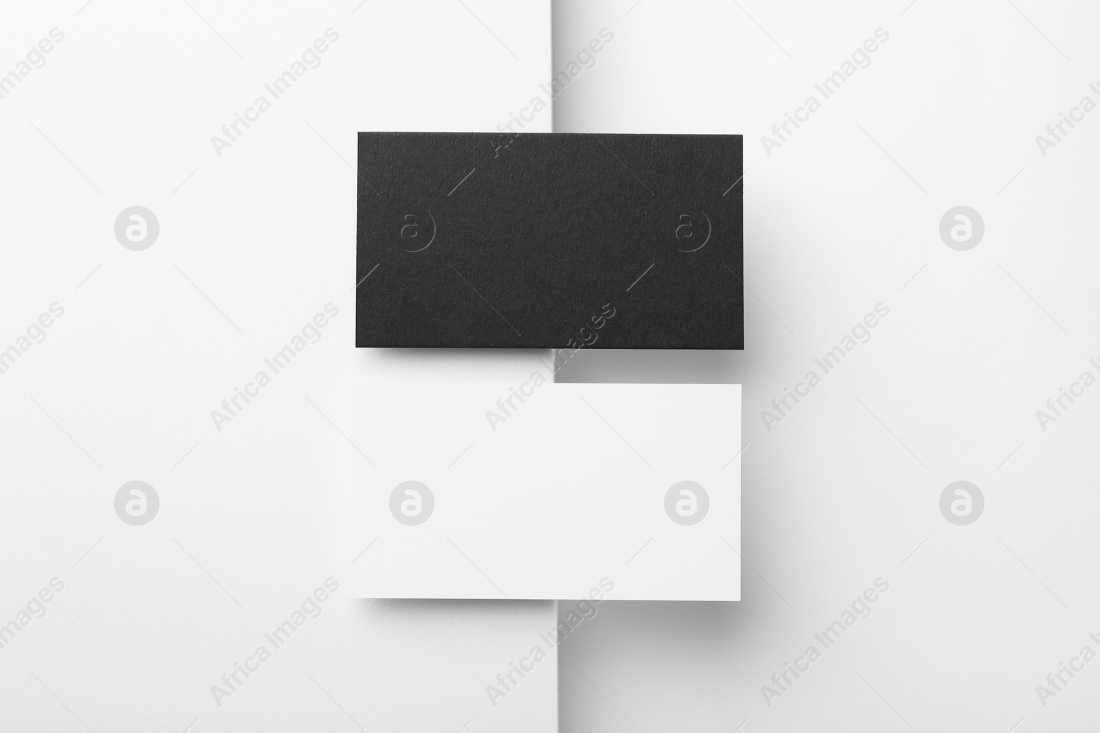 Photo of Blank business cards on white background, flat lay. Mockup for design