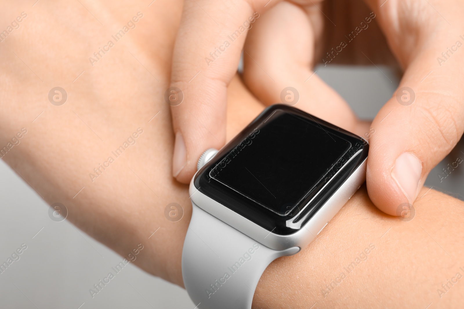 Photo of Woman checking pulse with help of smart watch, closeup