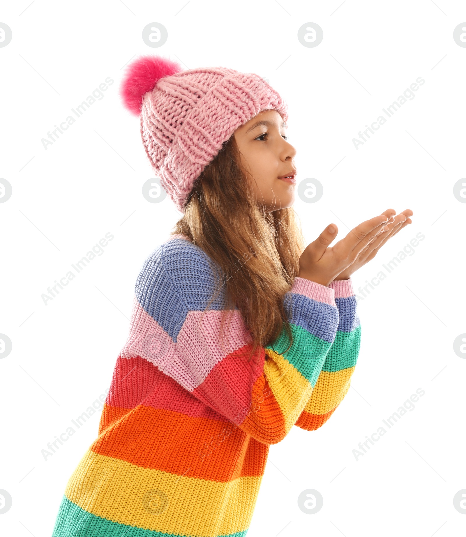 Photo of Cute little girl in warm clothes on white background. Winter vacation