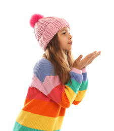 Photo of Cute little girl in warm clothes on white background. Winter vacation