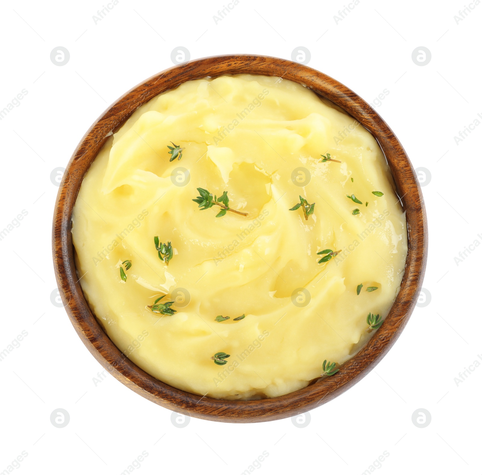 Photo of Bowl of delicious mashed potato with thyme isolated on white, top view