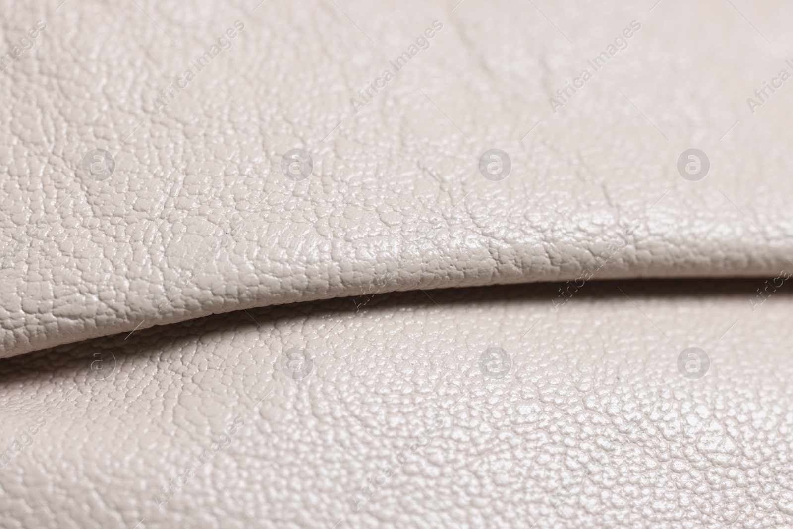 Photo of Beautiful beige leather as background, closeup view