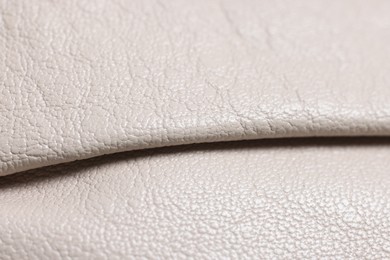 Photo of Beautiful beige leather as background, closeup view