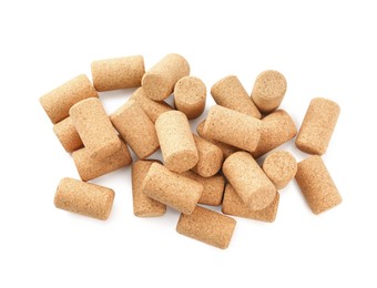 Photo of Heap of wine bottle corks isolated on white, top view