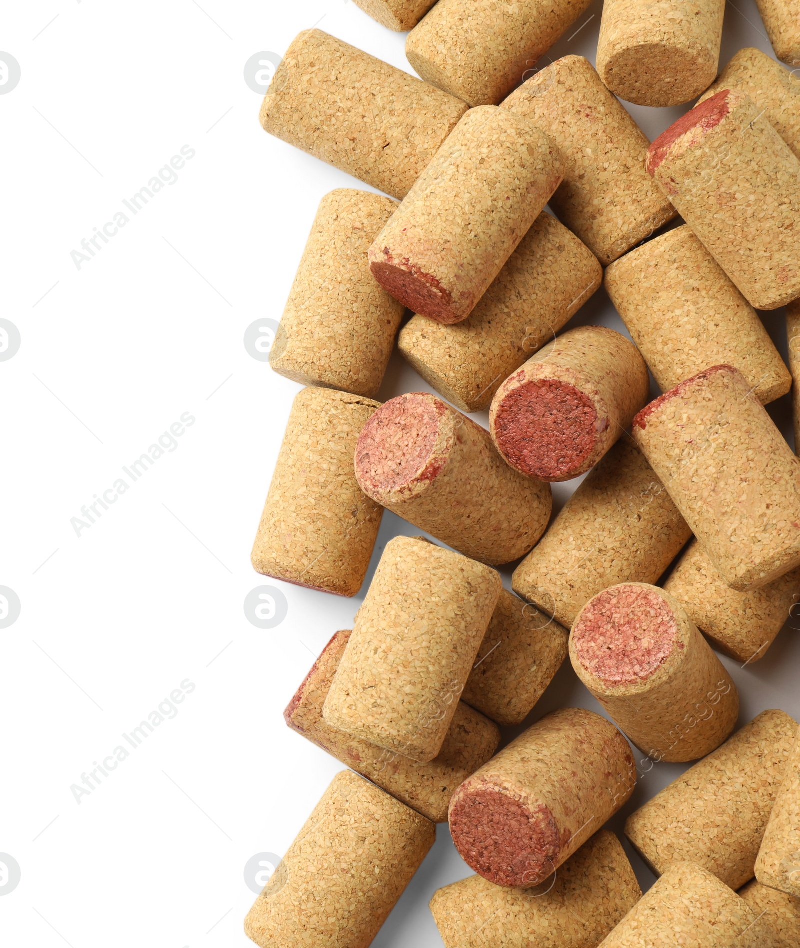 Photo of Wine bottle corks on white background, top view