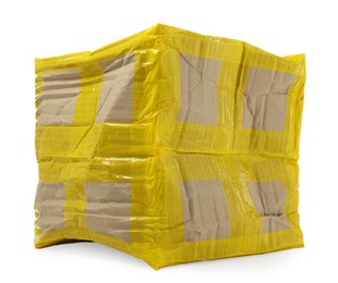 Crumpled cardboard parcel box with yellow sticky tape on white background