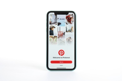 Photo of MYKOLAIV, UKRAINE - JULY 9, 2020: iPhone 11 with Pinterest app on screen against white background