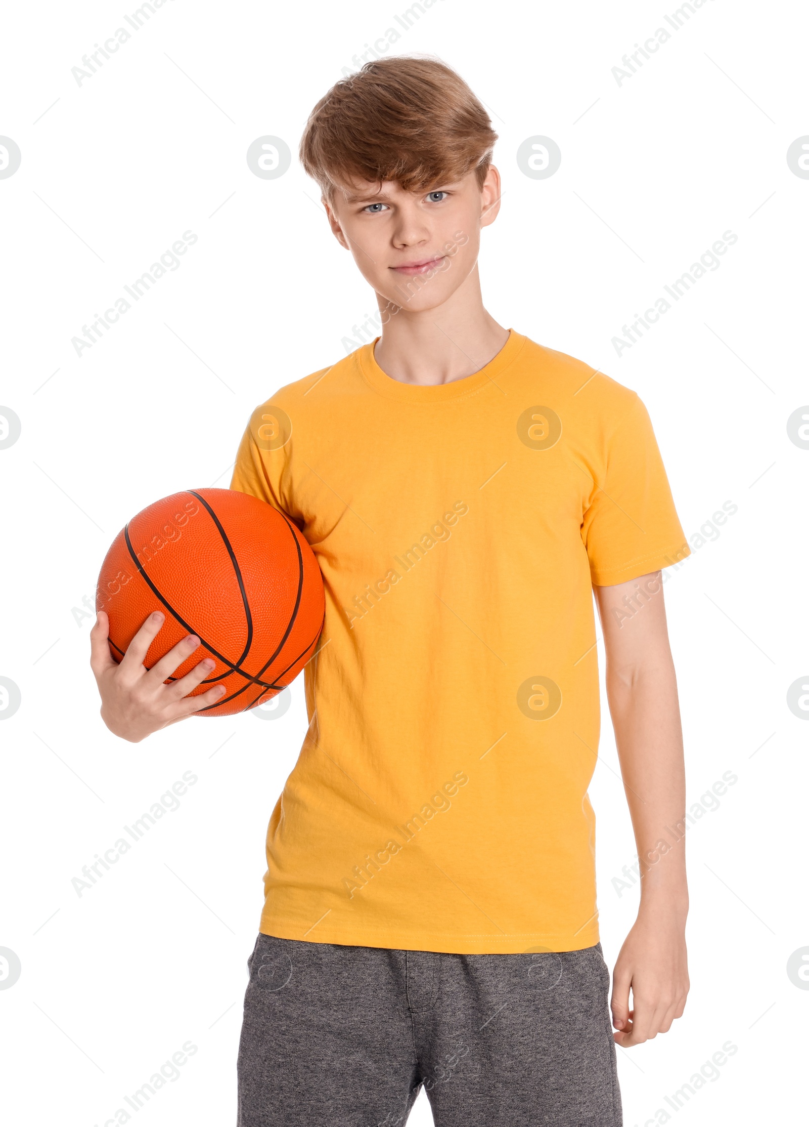 Photo of Teenage boy with basketball ball on white background