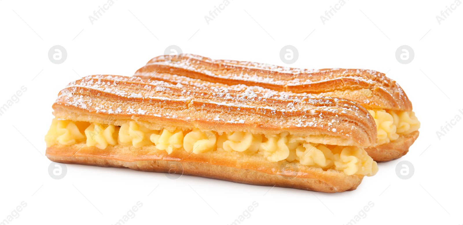 Photo of Delicious eclairs filled with cream isolated on white