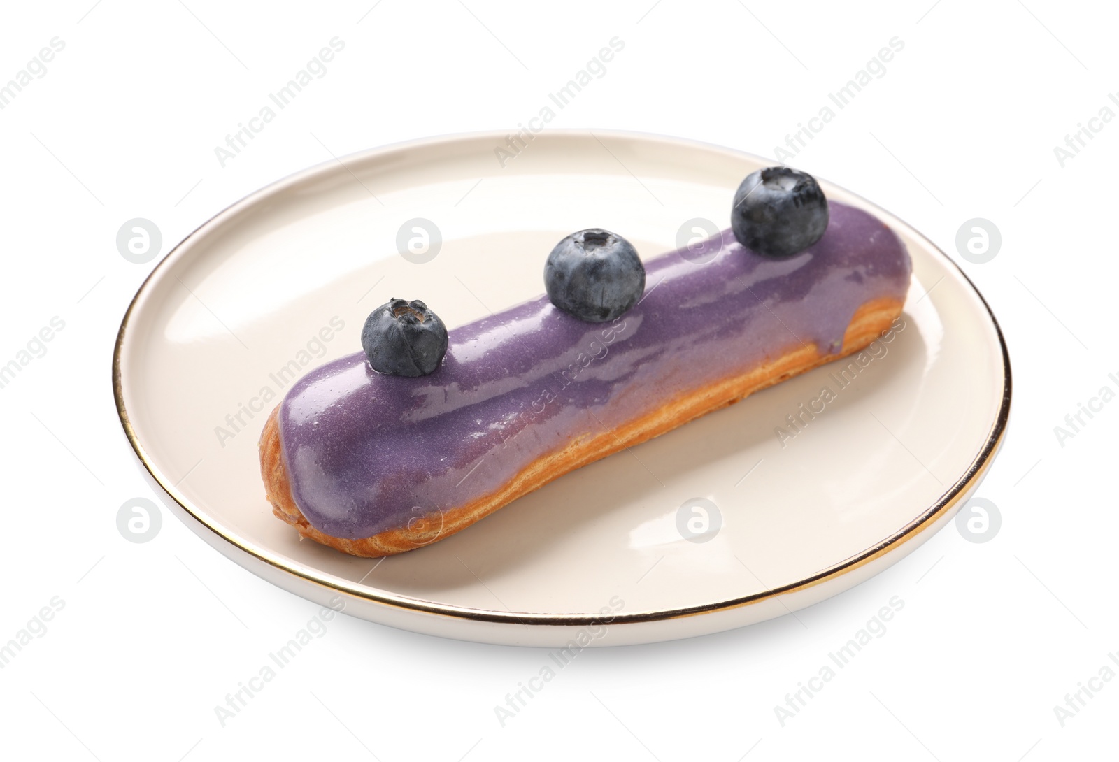 Photo of Delicious eclair decorated with blueberries isolated on white