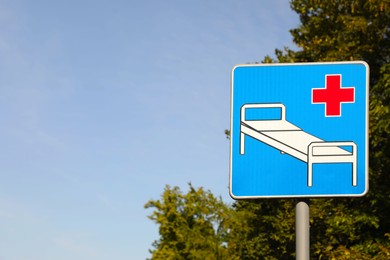 Road sign Hospital outdoors on sunny day. Space for text