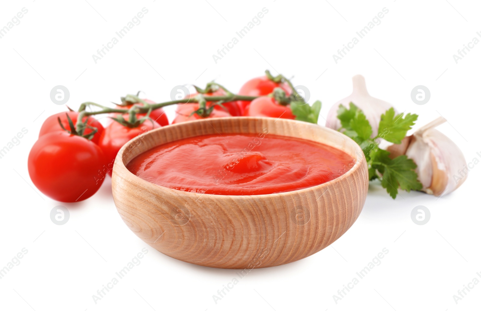 Photo of Tomato sauce and ingredients on white background, closeup