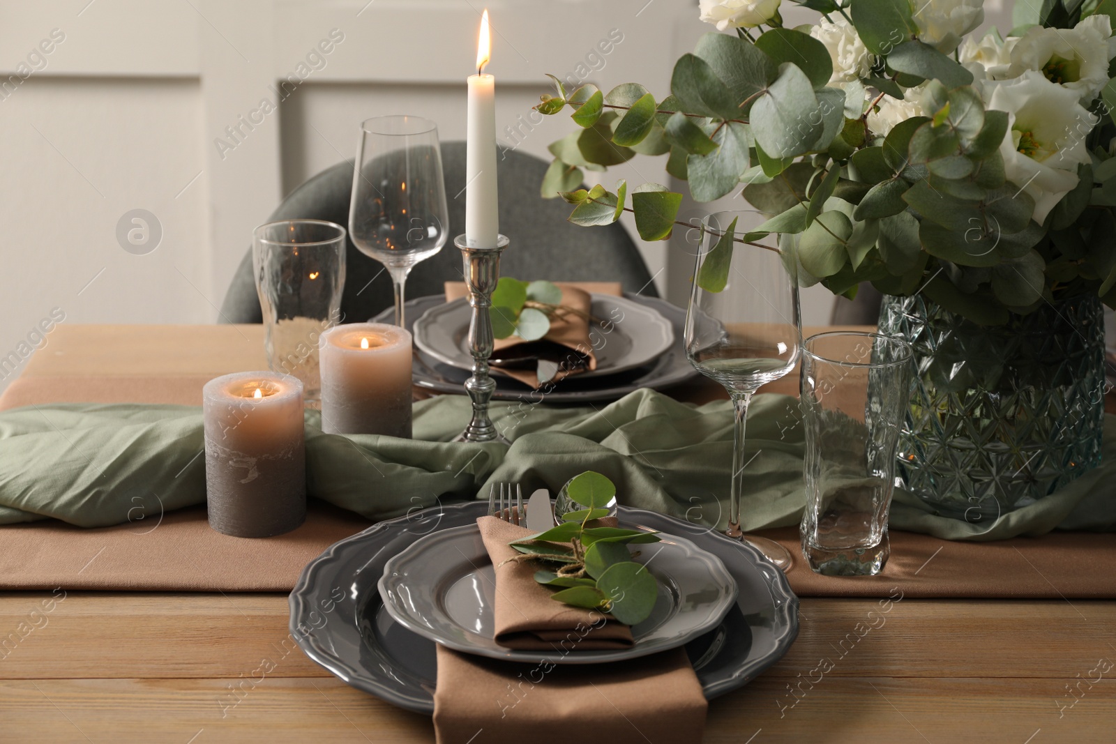 Photo of Festive table setting with beautiful floral decor indoors