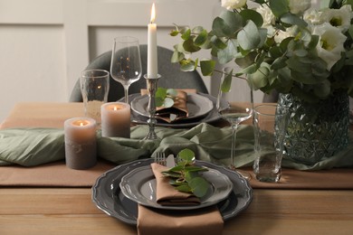 Photo of Festive table setting with beautiful floral decor indoors