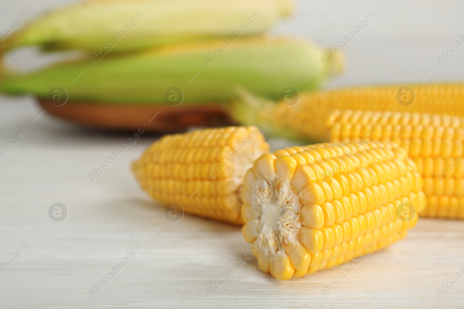 Photo of Tasty sweet corn cob on table, closeup