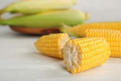 Tasty sweet corn cob on table, closeup