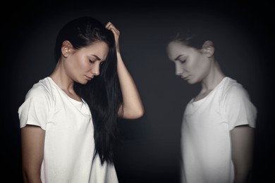 Image of Woman suffering from mental illness on black background. Dissociative identity disorder
