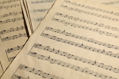 Photo of Many old note sheets as background, closeup