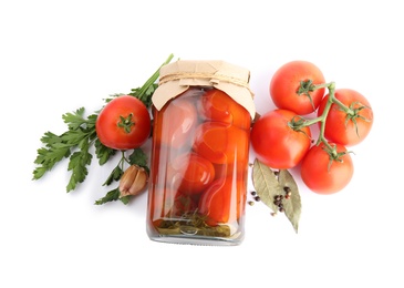 Photo of Pickled tomatoes in glass jar and products on white background