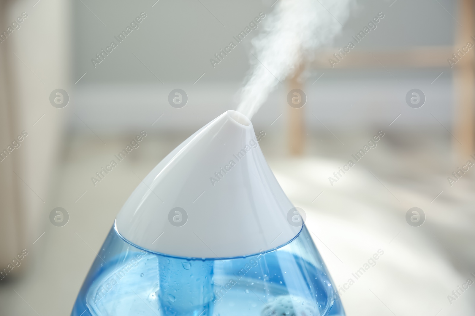 Photo of Modern air humidifier at home, closeup view