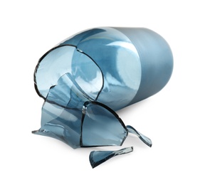 Broken blue glass vase isolated on white