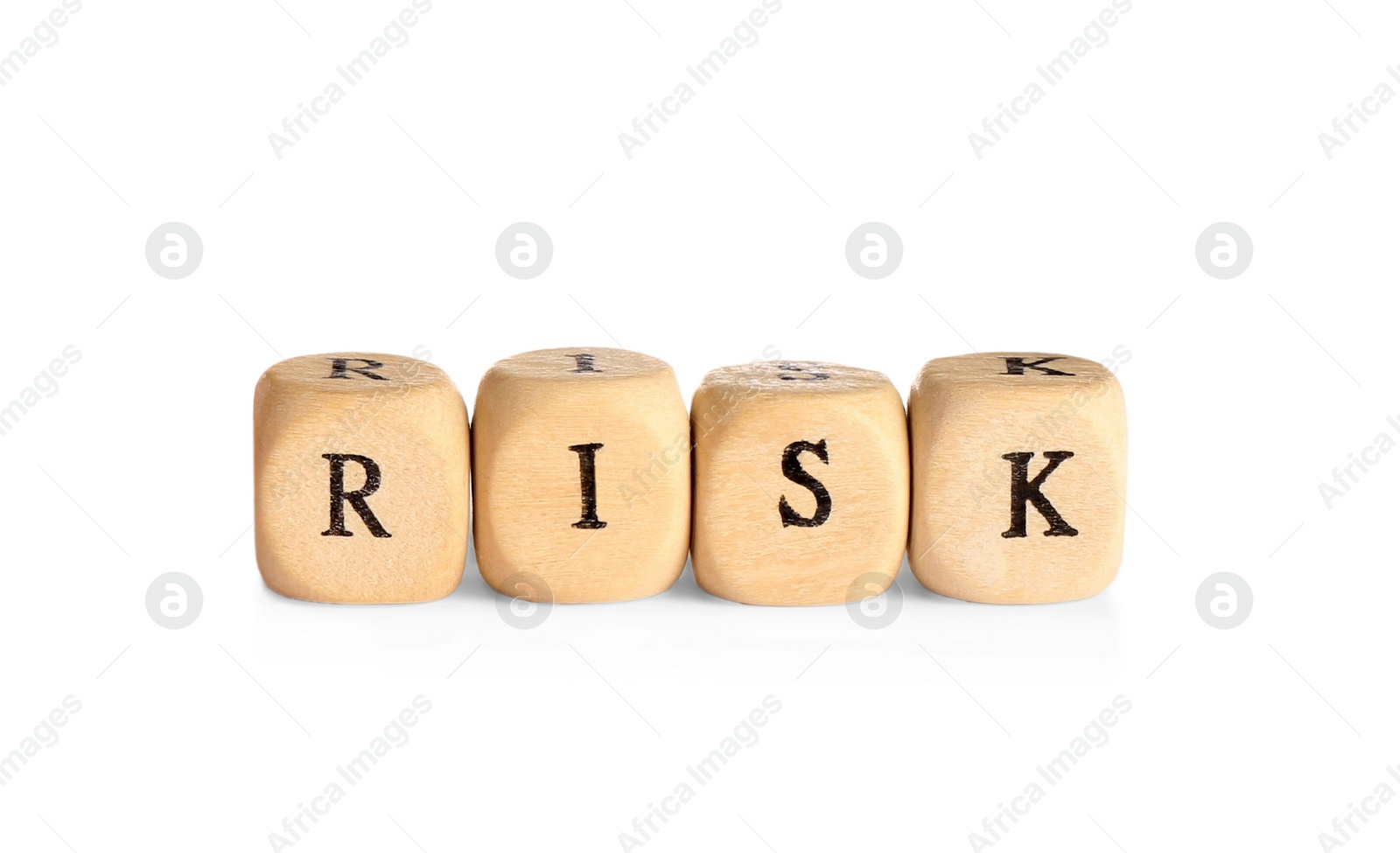 Photo of Wooden cubes with word Risk isolated on white