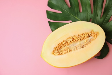 Photo of Flat lay composition with melon, tropical leaf and space for text on color background