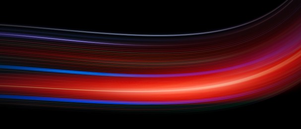 Image of Colorful speed light trails on black background, motion blur effect. Banner design