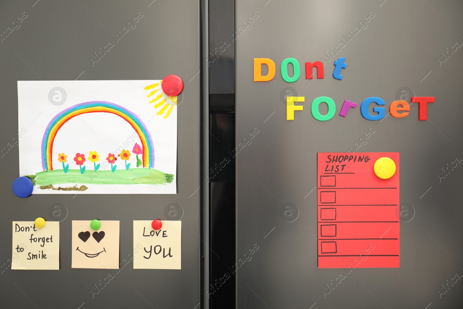 Photo of Modern refrigerator with child's drawing, notes and magnets