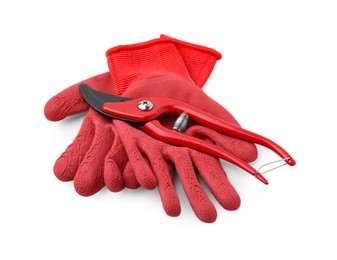 Photo of Pair of red gardening gloves and secateurs isolated on white