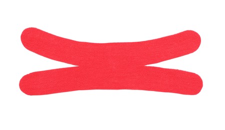 Photo of Red kinesio tape piece on white background, top view