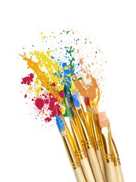 Image of Different brushes and paint splatters on white background, top view