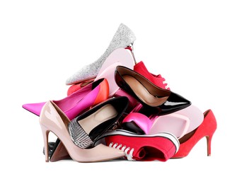 Pile of different female shoes isolated on white