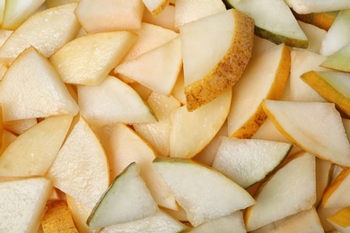 Photo of Ripe tasty melon slices as background, closeup view