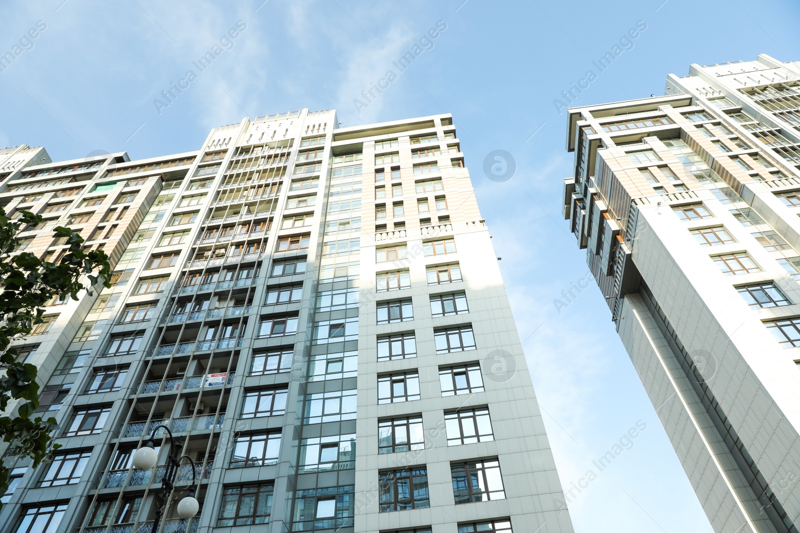 Photo of KYIV, UKRAINE - MAY 21, 2019: Beautiful view of modern housing estate in Pecherskyi district on sunny day, low angle