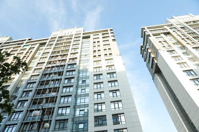 KYIV, UKRAINE - MAY 21, 2019: Beautiful view of modern housing estate in Pecherskyi district on sunny day, low angle