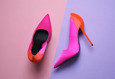 Photo of Pair of beautiful shoes on color background, top view