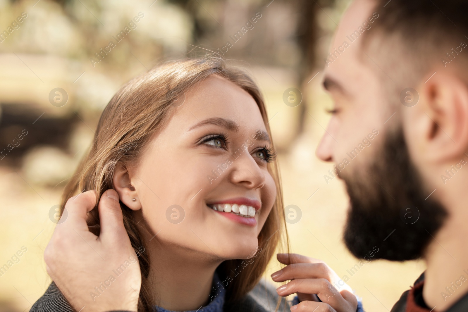 Photo of Portrait of cute young couple outdoors, closeup