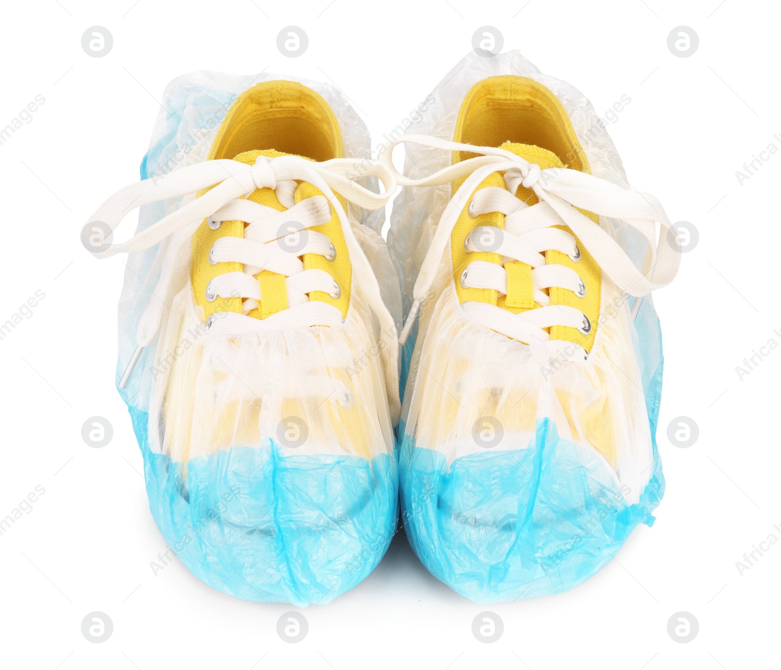 Photo of Sneakers in blue shoe covers isolated on white