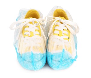 Sneakers in blue shoe covers isolated on white