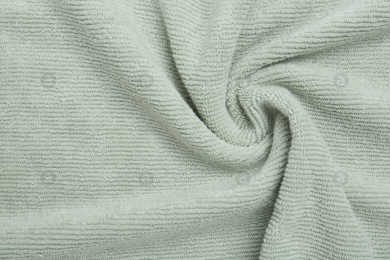 Photo of Crumpled soft towel as background, top view
