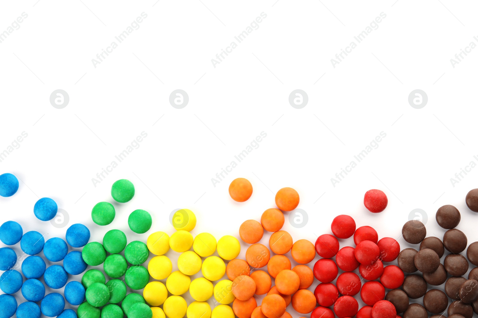 Photo of Tasty colorful candies on white background, top view