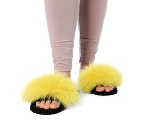 Photo of Woman in fluffy slippers on white background, closeup