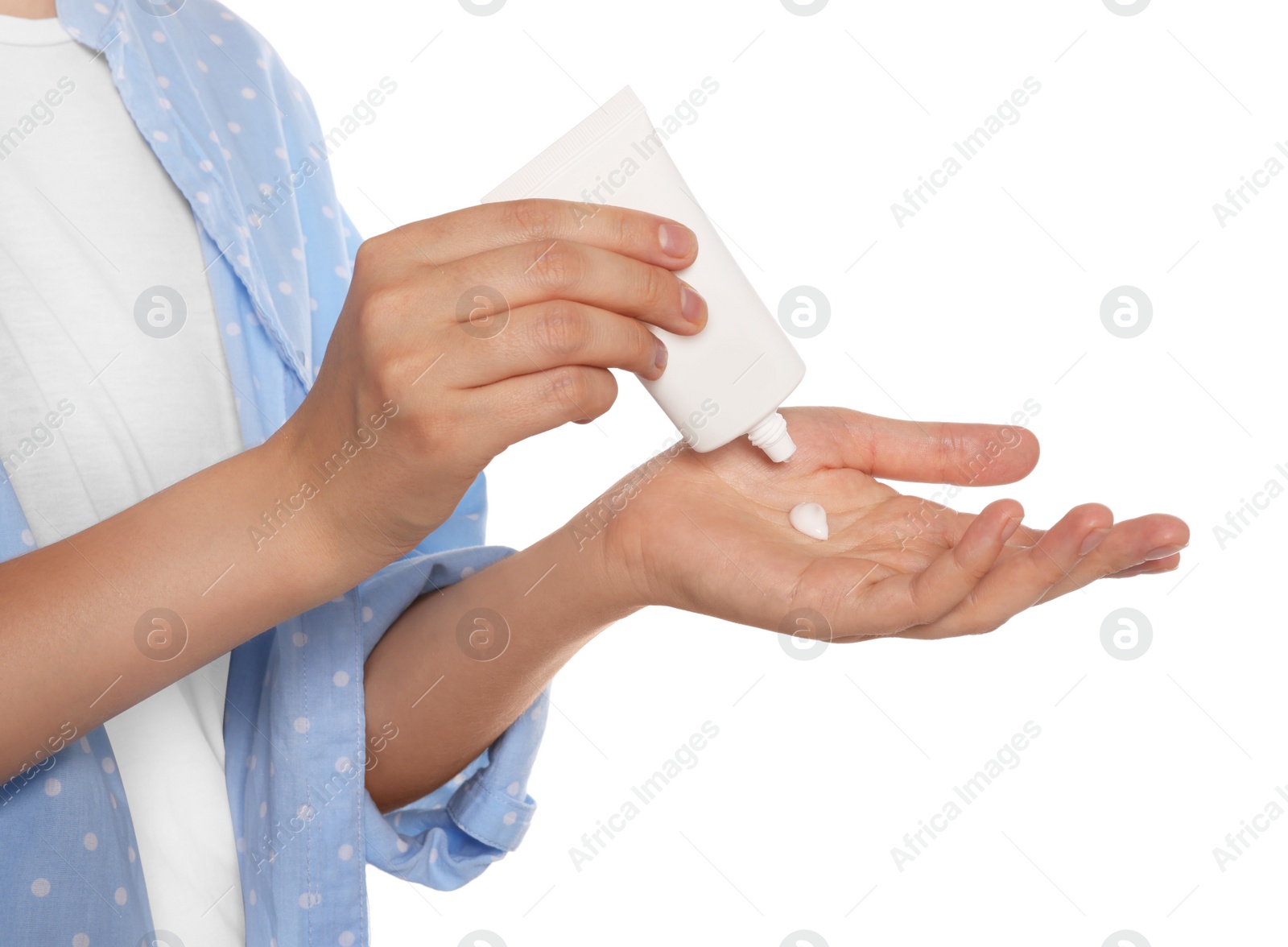 Photo of Woman applying cream on her hand against white background, closeup