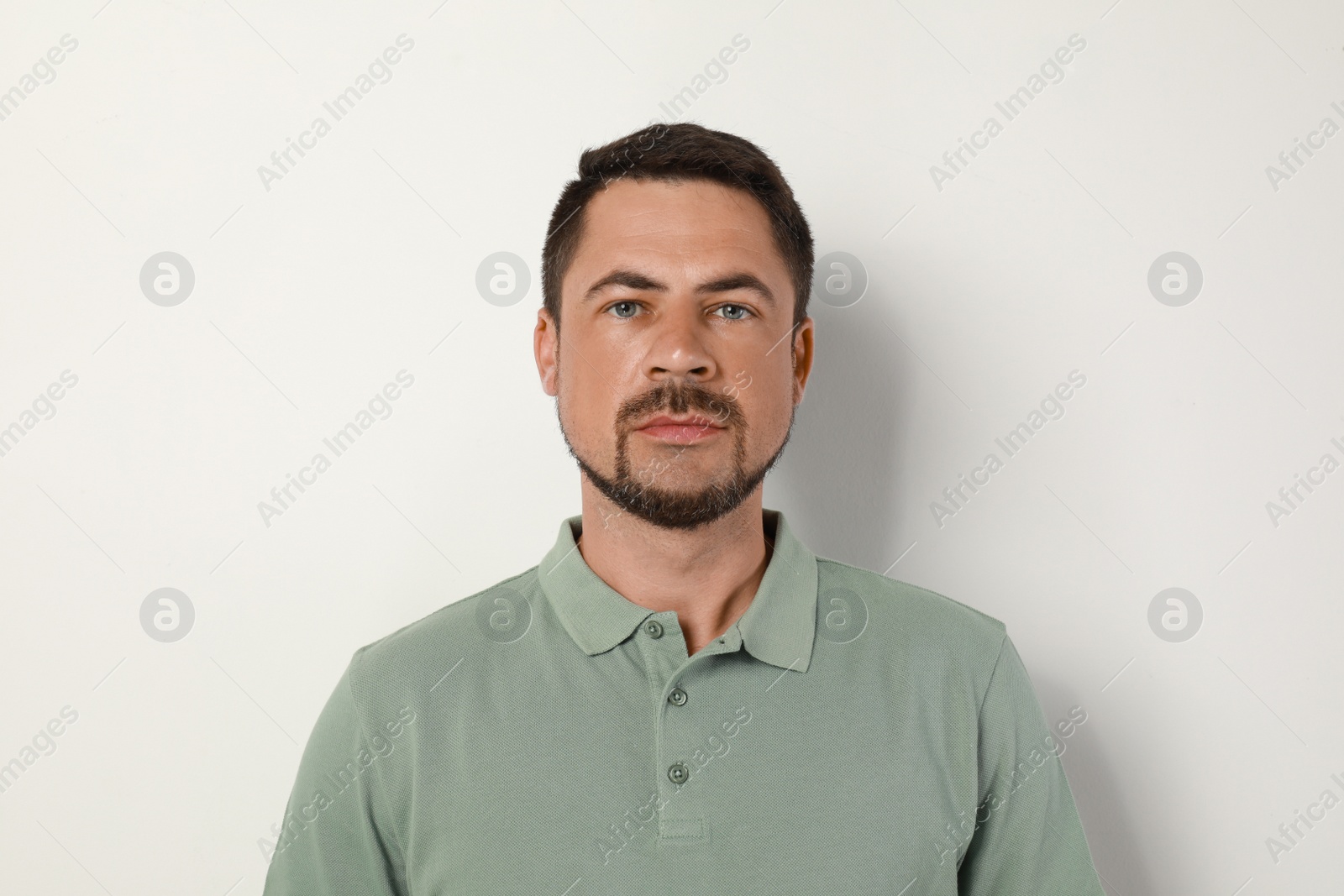 Photo of Portrait of handsome man on light background