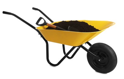 Photo of Yellow wheelbarrow with soil and shovel isolated on white. Gardening tools