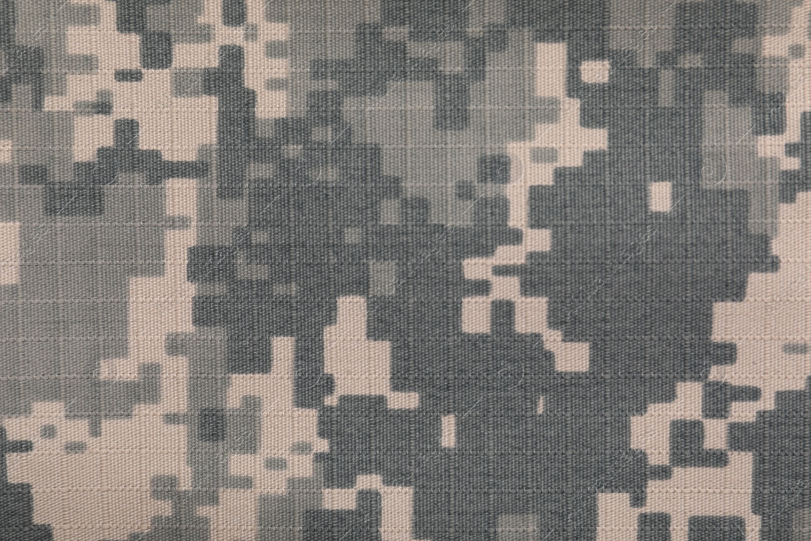 Photo of Texture of camouflage fabric as background, top view