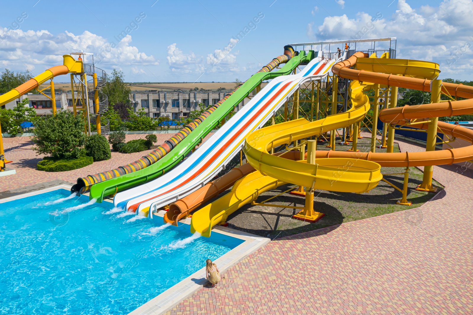 Image of Aerial view of water park on sunny day